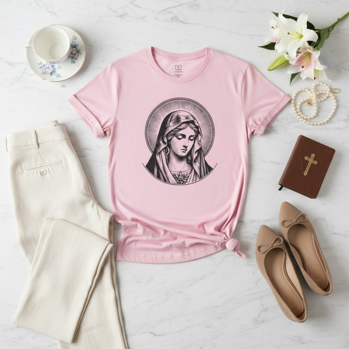 Pink women’s t-shirt featuring a vintage illustration of the Virgin Mary with the Sacred Heart — Catholic apparel for women of faith.