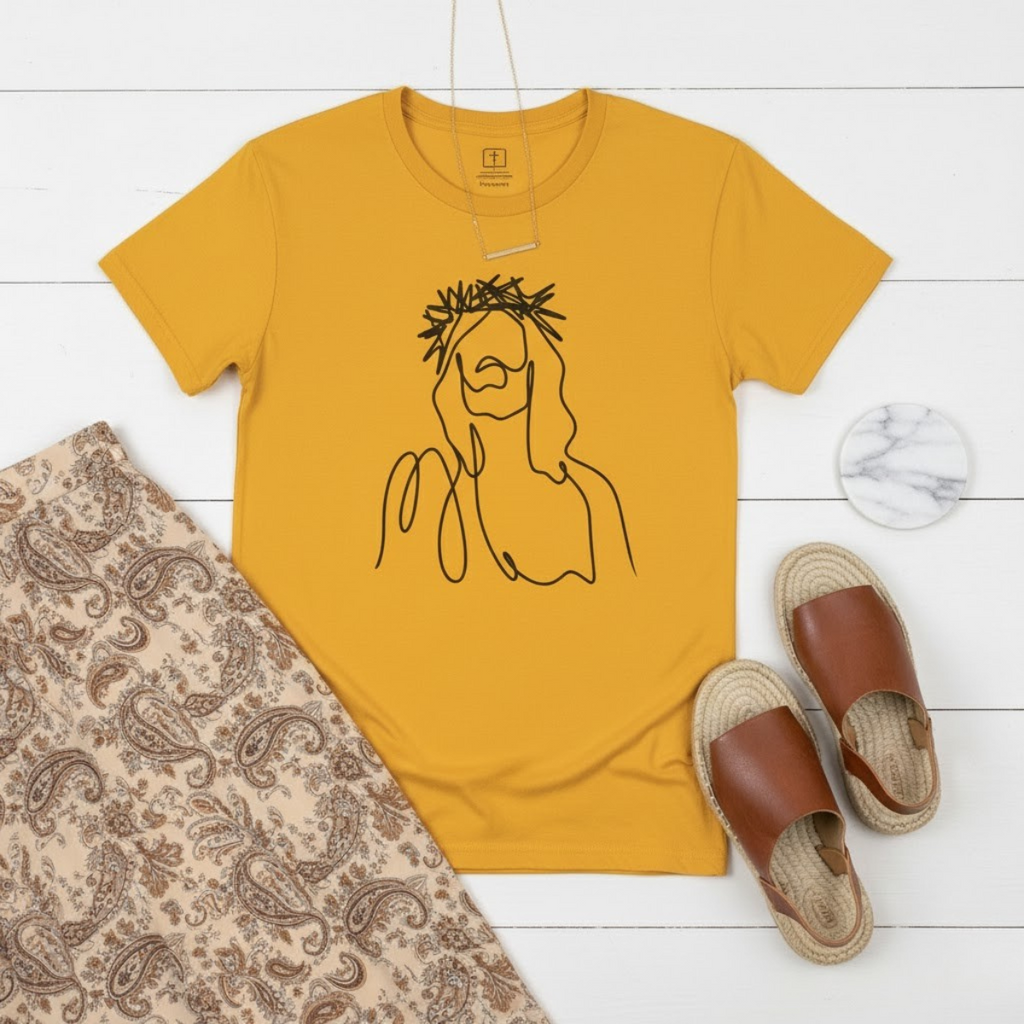 Yellow women’s t-shirt featuring a minimalist line drawing of Jesus with a crown of thorns — Christian apparel expressing faith through art.