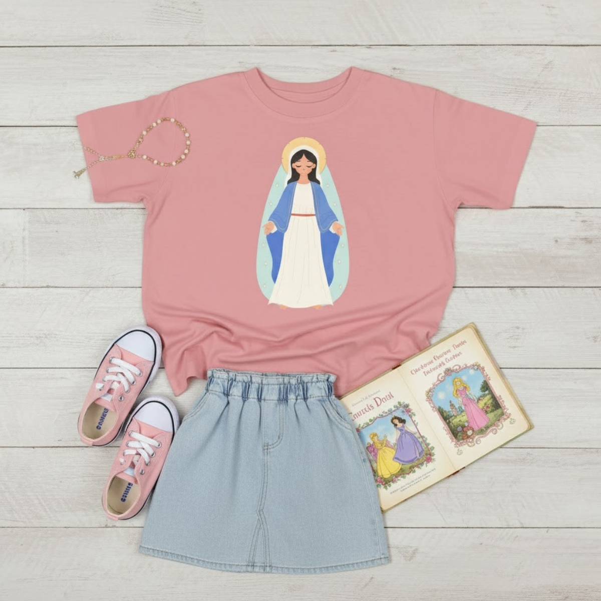 Pink toddler t-shirt featuring a child-friendly illustration of the Virgin Mary — Catholic girls’ apparel celebrating faith and love.