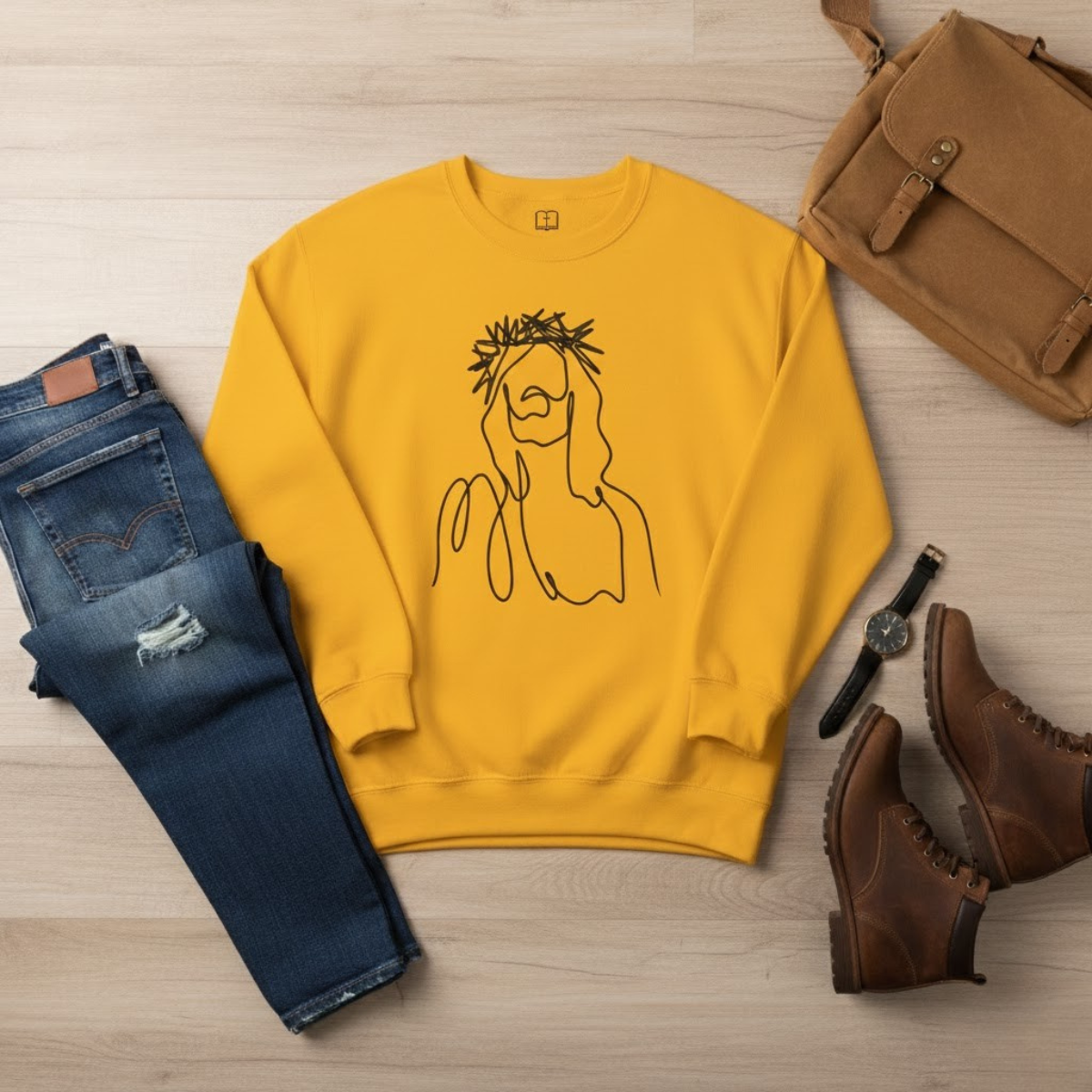 Yellow men’s sweatshirt featuring a minimalist line drawing of Jesus crowned with thorns — modern Catholic apparel for men.