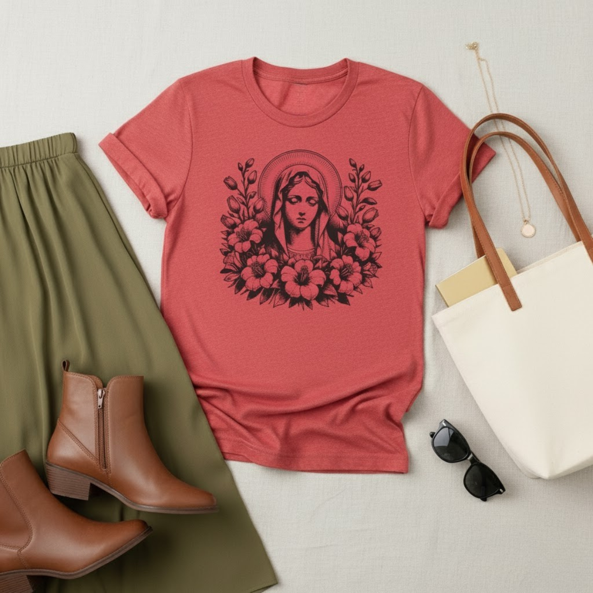 Pink women’s fleece sweatpants with gold embroidered Marian symbol — Catholic loungewear for comfort and devotion.